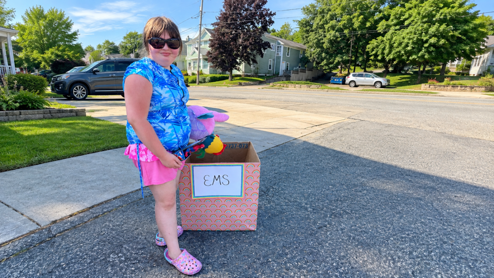 Ainslee Manduca with one of her donation boxes. Submitted photo