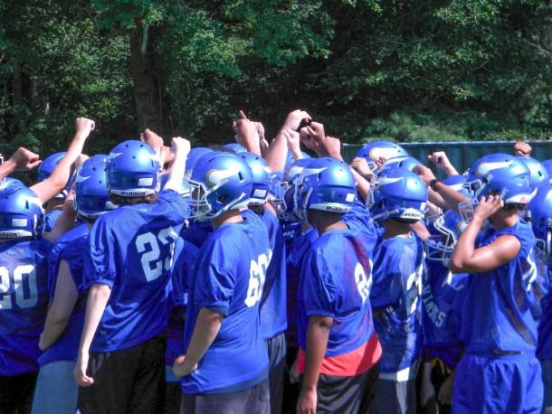 The Vikings players huddle up before practice. Photo by Christian Uva