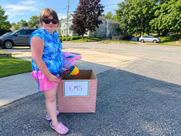 Ainslee Manduca with one of her donation boxes. Submitted photo