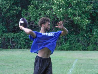 Senior quarterback Amare Rose throws a pass. Photo by Christian Uva