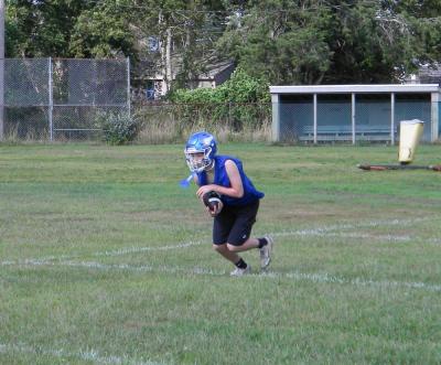 A player catches a ball during a turnover drill. Photo by Christian Uva