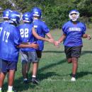 Players high five during warmups. Photo by Christian Uva