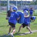 A wide receiver in a blocking drill. Photo by Christian Uva