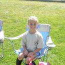 Scarlett Braley, 6, rests after her first game of the season.