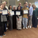 Fourteen district teachers received professional status.