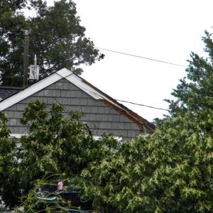 An edge of the garage roof was sliced open, but much of the garage remained unharmed.
