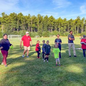 The Elks and Youth Soccer players gather around.