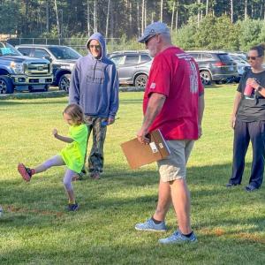 A Youth Soccer player hits a shot while Elks volunteers watch on. Photos by Jim Callan