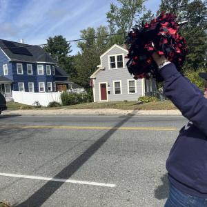 Volunteer Kimmy Schenter cheered cyclists on as they passed through Wareham. 