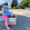 Ainslee Manduca with one of her donation boxes. Submitted photo
